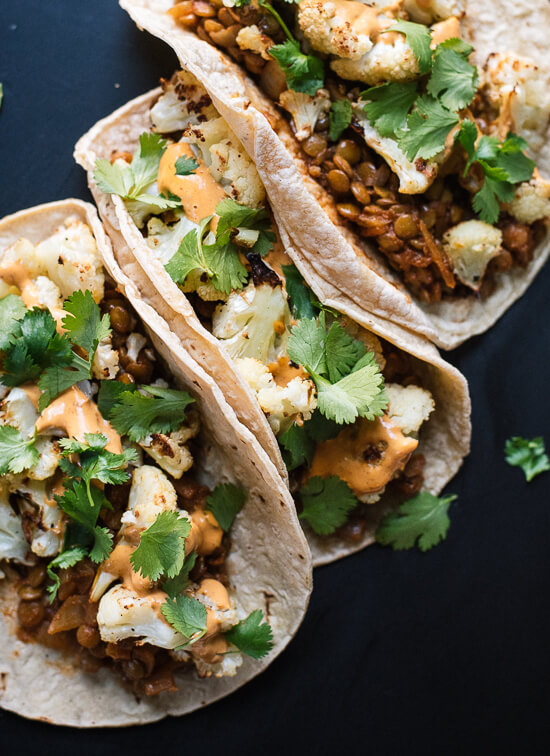 Roasted cauliflower, seasoned lentils and creamy chipotle sauce combine to create an unexpectedly delicious taco! - cookieandkate.com