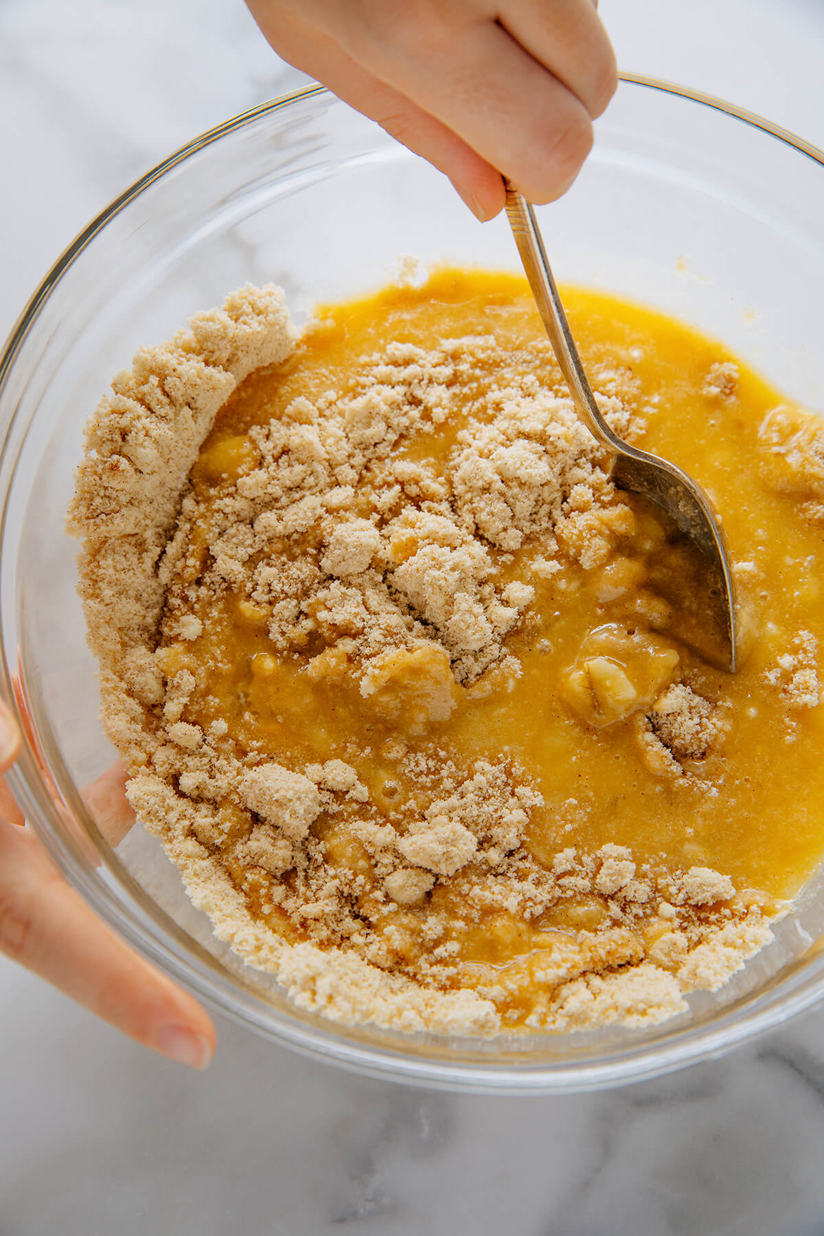 mixing banana muffin batter